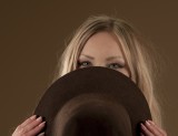 Behind the hat